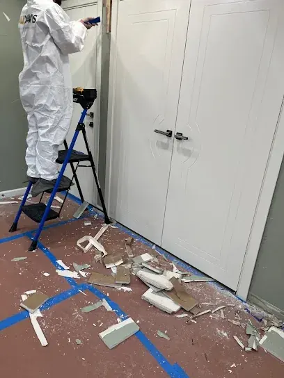 Technician setting up containment by a doorway in Brooklyn