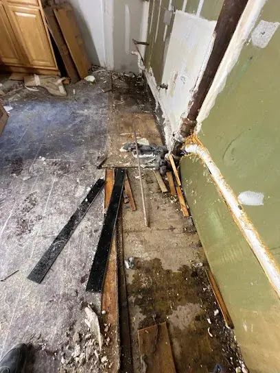 Water damaged floor and wall opened for drying in Brooklyn