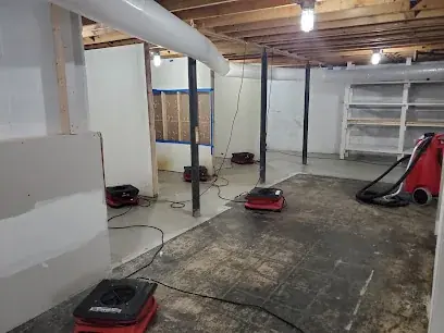 Air movers drying a Brooklyn basement
