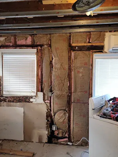 Studs exposed and dried in a Brooklyn bathroom